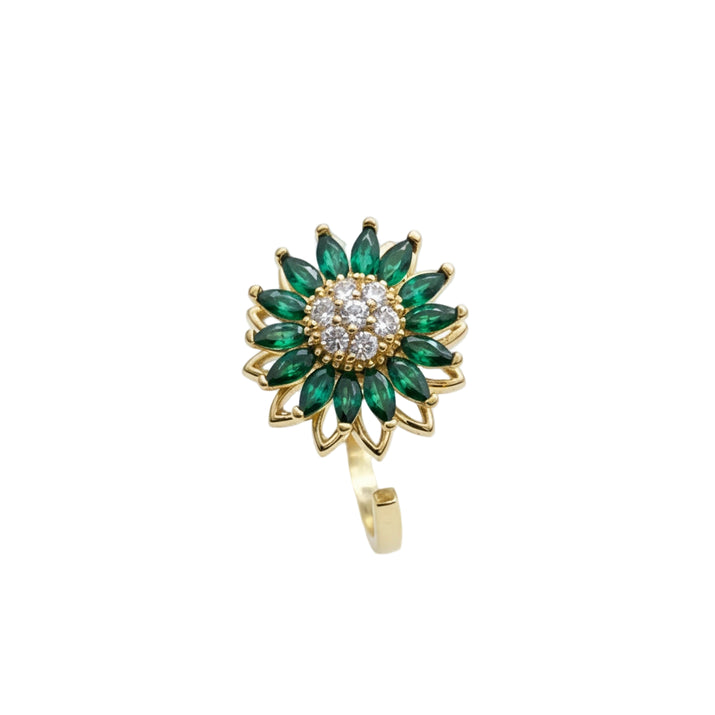 Gold ring with emerald green gemstones on a white background - spinning anxiety ring
