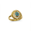 Gold ring with blue gemstone and diamond accents on a white background