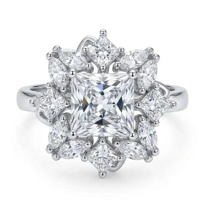Diamond ring with a star-like design on a white background