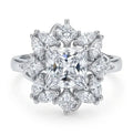 Diamond ring with a star-like design on a white background