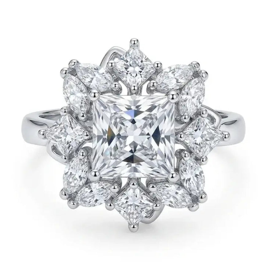 Diamond ring with a star-like design on a white background