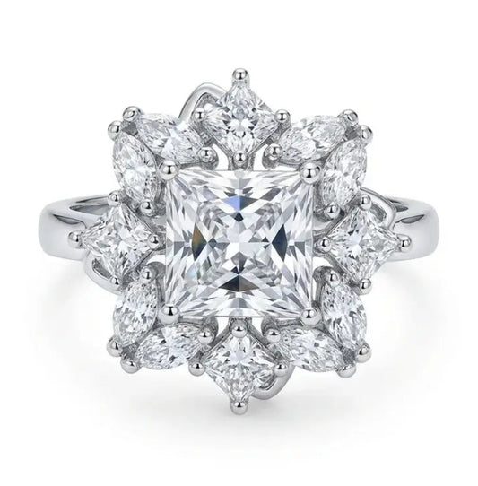 Diamond ring with a star-like design on a white background