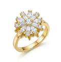 Gold ring with diamond-like stones on a white background