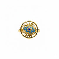 Gold ring with blue gemstone on a white background