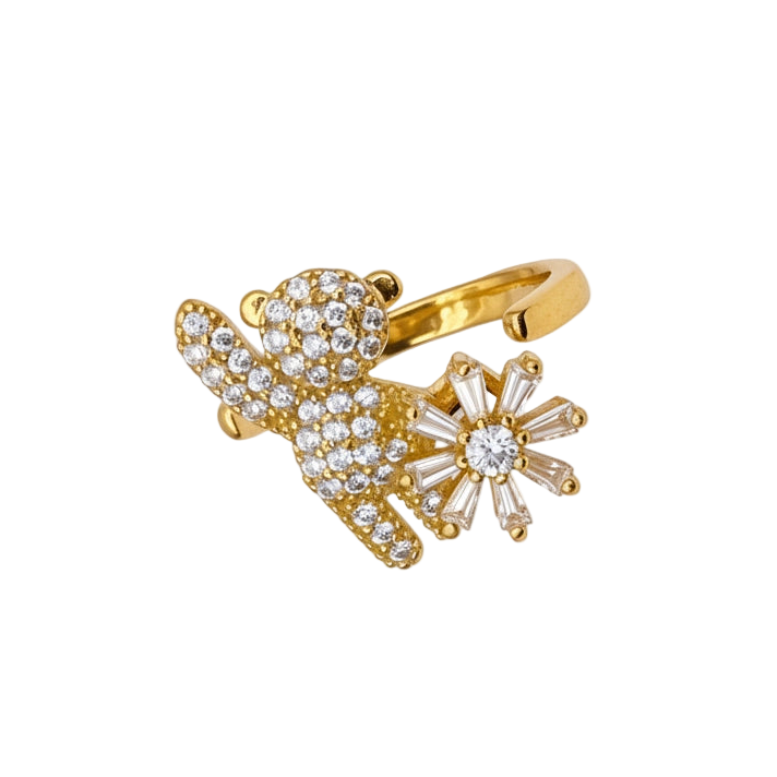 Gold ring with diamond accents on a white background