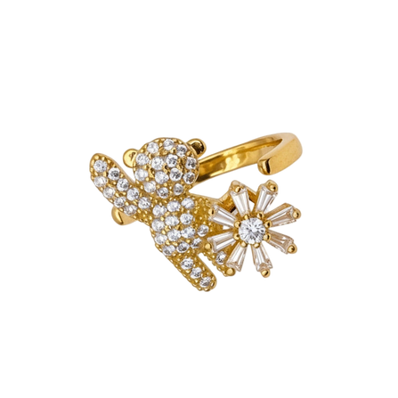 Gold ring with diamond accents on a white background
