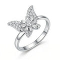 Silver butterfly-shaped ring with diamond accents on a white background