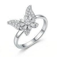 Silver butterfly-shaped ring with diamond accents on a white background